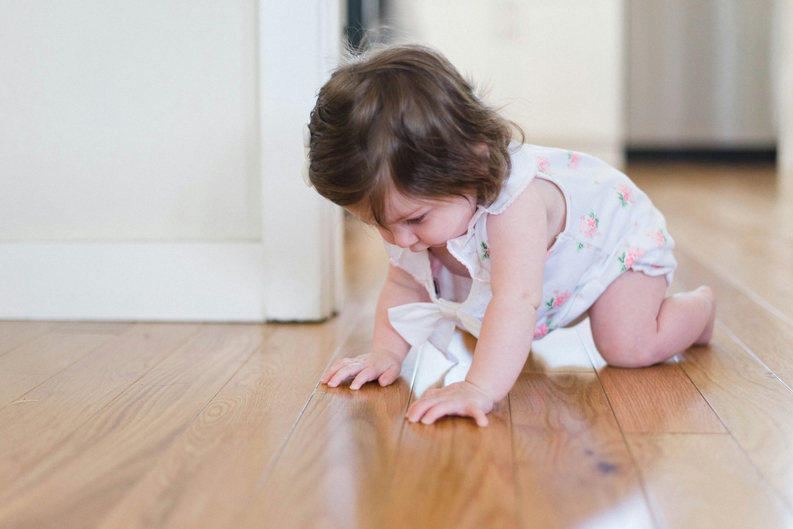 A baby crawling, representing the foundational movements that drive neuroplasticity and brain reorganization.