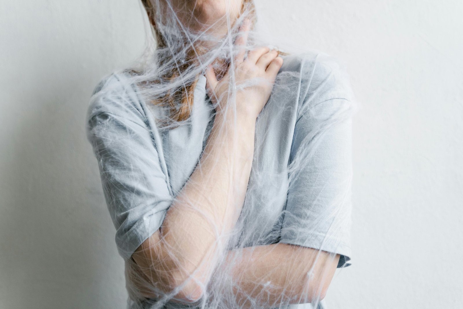 Person stressed covered in a spider web